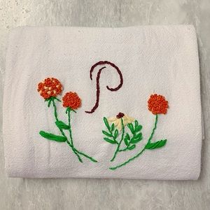 Embroidered monogram hand towel.